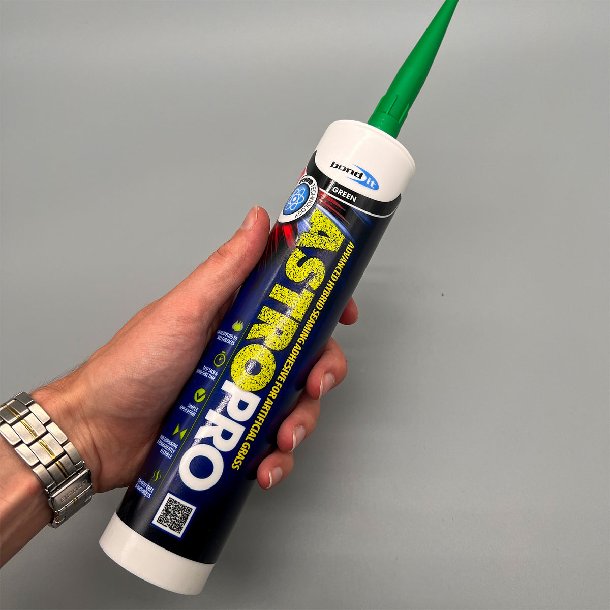 Bond It Astro Pro 285ml cartridge held in hand showing size for turf seaming jobs