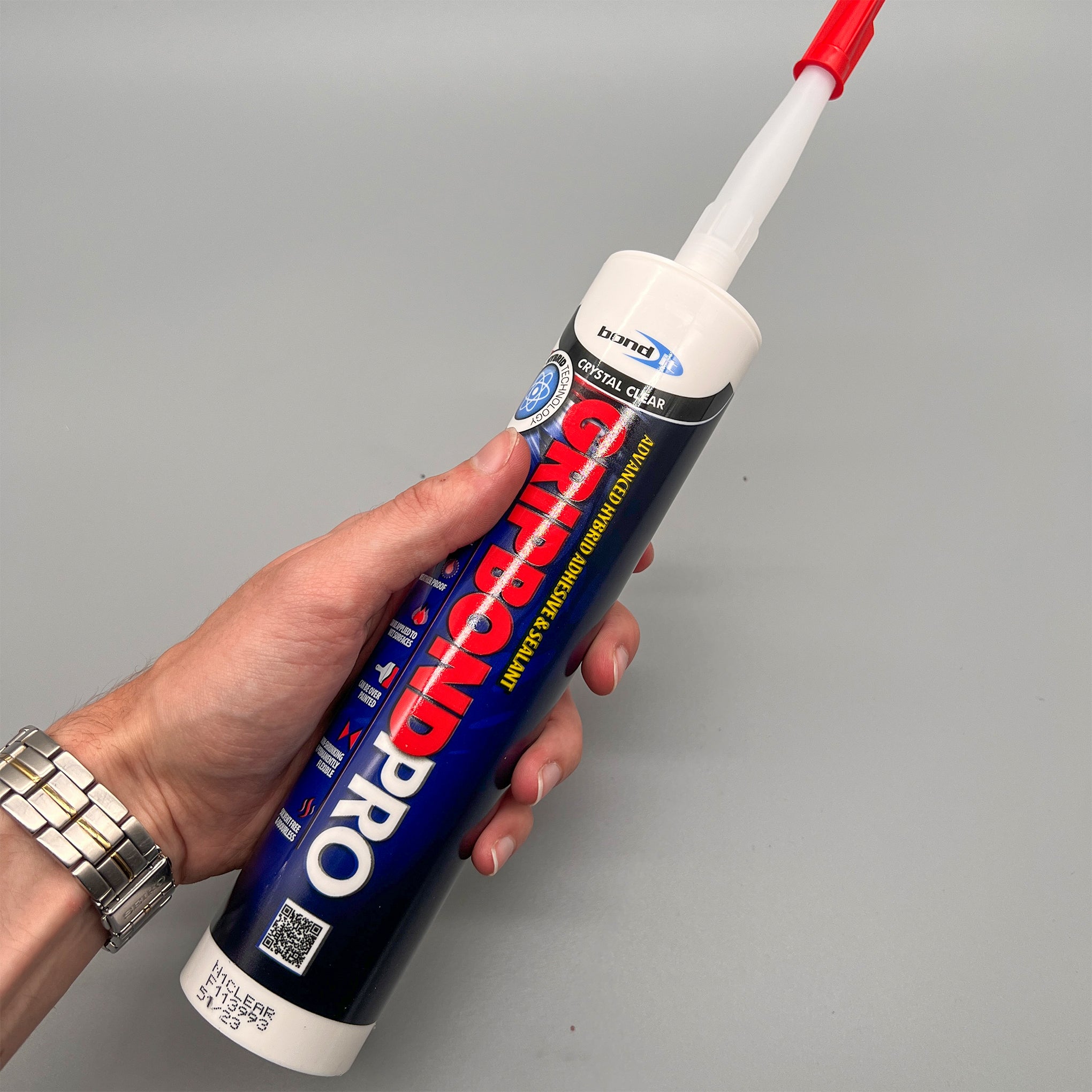 Bond It Gripbond Pro Clear adhesive tube shown in hand for scale and usability