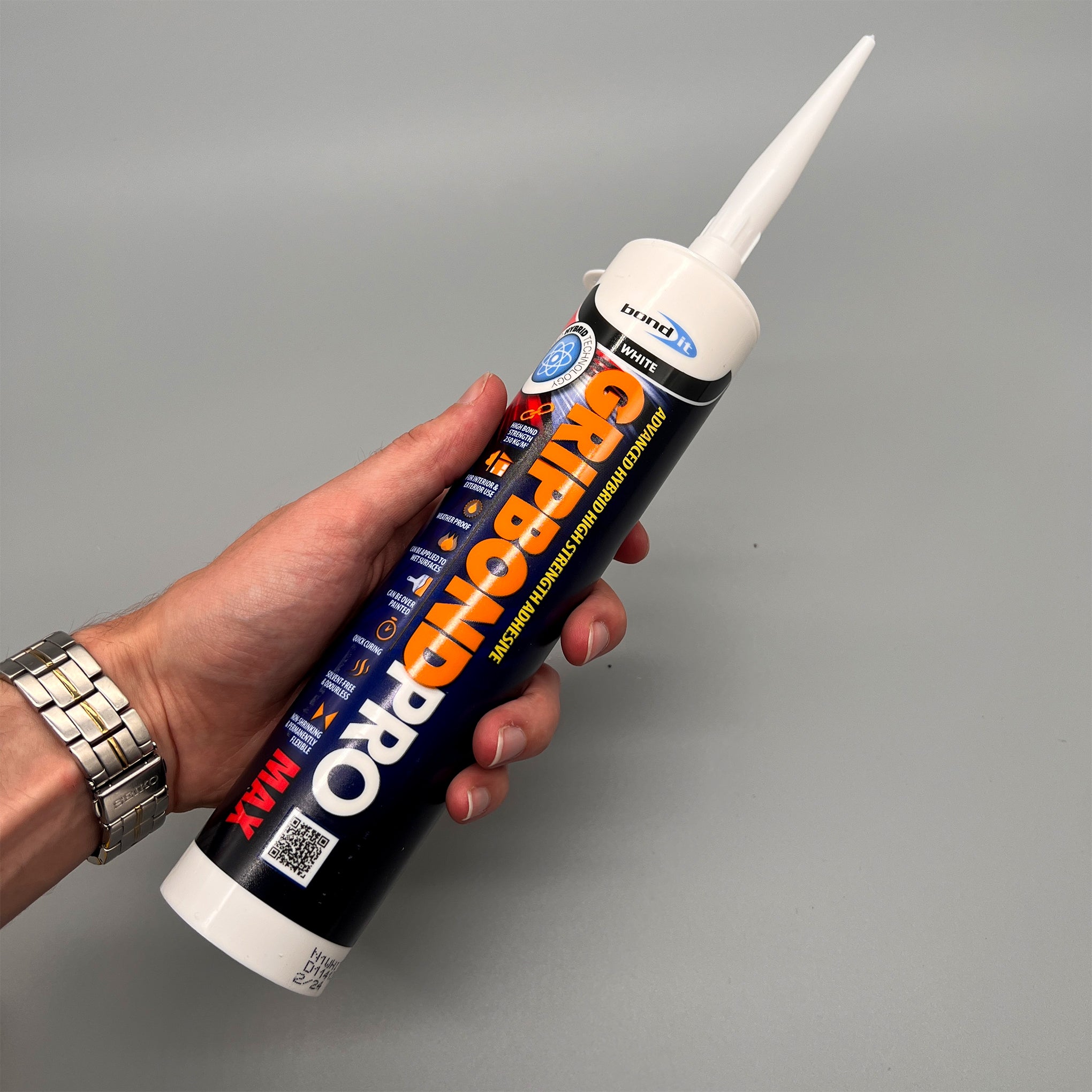 Bond It Gripbond Pro Max White adhesive tube held in hand – professional grab adhesive for trade use