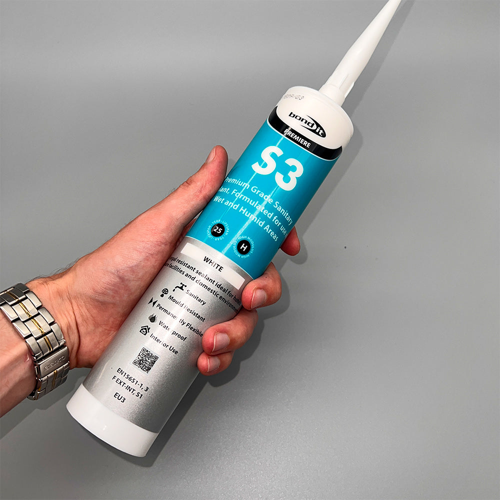 Bond It S3 white sanitary silicone 310ml held in hand showing cartridge size